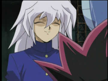 A picture of Ryou smiling... and the tips of Yugi's hair!