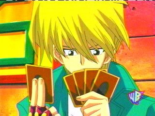 Joey looking at his cards